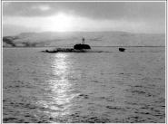 АПЛ К-276 (зав. № 302, с 03.06.1992. - Б-276, с 06.04.1993. - "Краб", с 15.11.1996. - "Кострома"), после столкновения 11 февраля 1992 года с АПЛ «Батон-Руж» класса «Лос- Анджелес». Снимок сделал во время сопровождения лодки в базу с борта спасательного буксира СБ-523 дежуривший на нём в числе спасательного отряда Северного флота